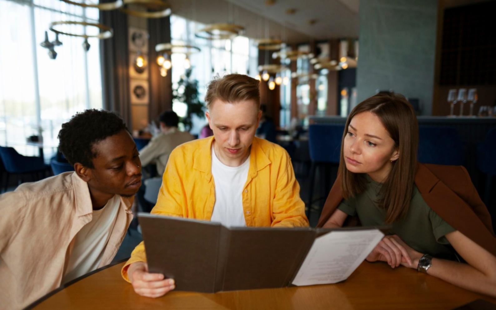 Quality assurance team conducting comprehensive mobile app testing in professional environment